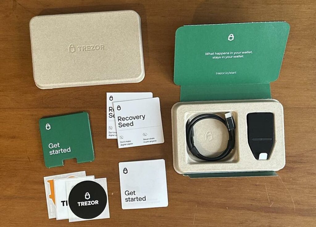 The Trezor Safe 3 hardware wallet, along with the contents that come in the box, from TREZOR